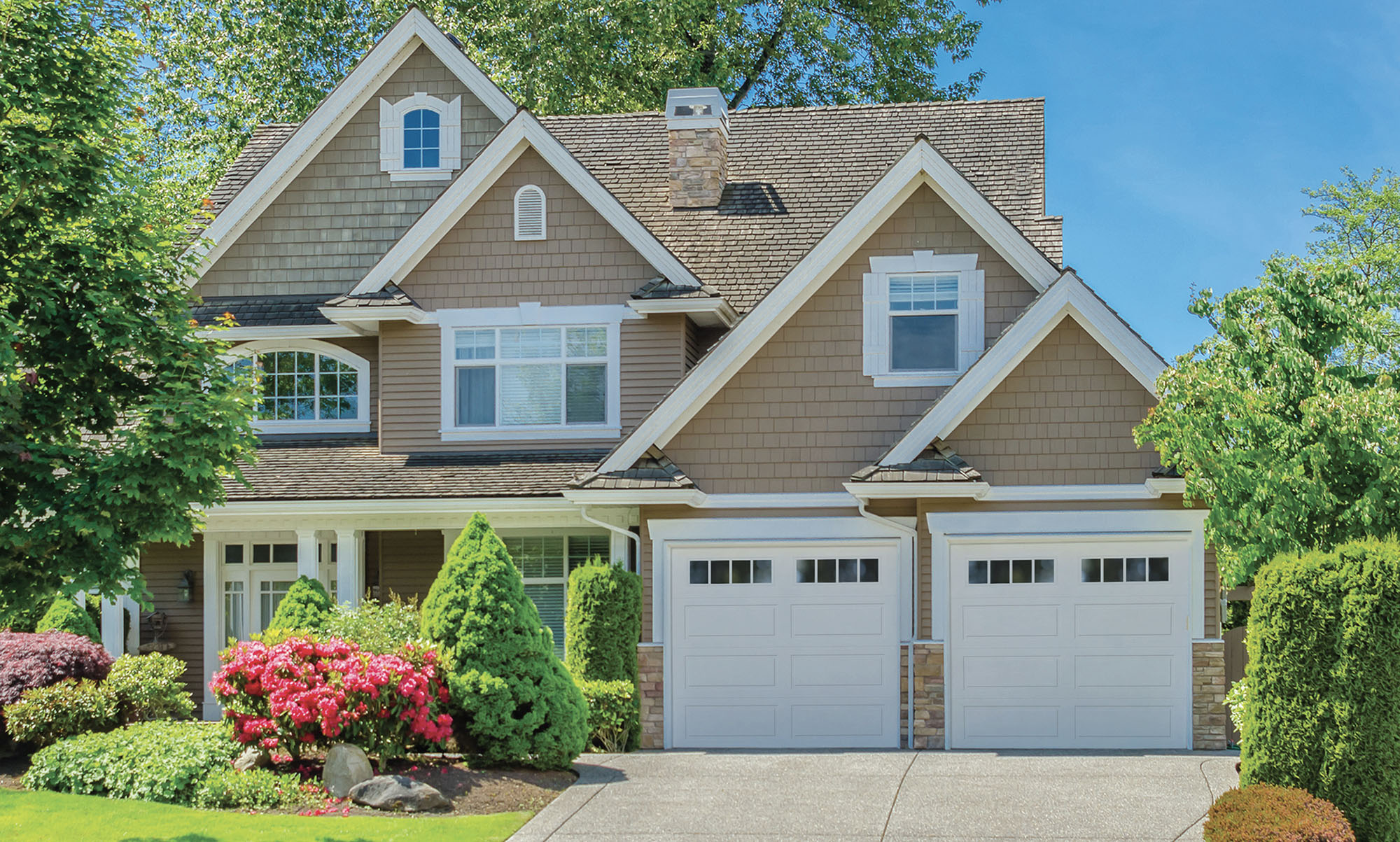 Home with Long panel legacy garage doors